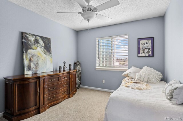20466 Willowbend Ln, Parker, CO 80138 - bedroom with ceiling fan, a textured ceiling, light colored carpet, and baseboards