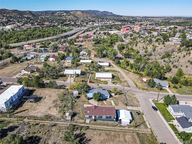 birds eye view of property with a mountain view