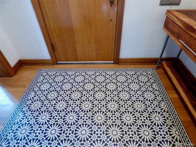 details featuring baseboards and wood finished floors