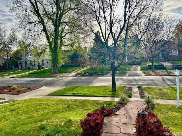 view of road with sidewalks and a residential view