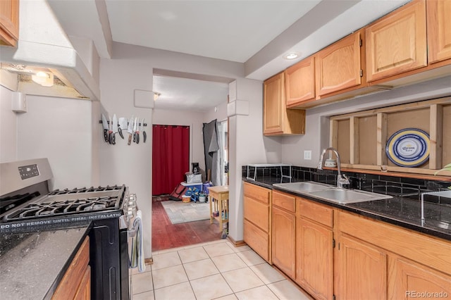 kitchen with light hardwood / wood-style floors, gas range, light brown cabinetry, range hood, and sink