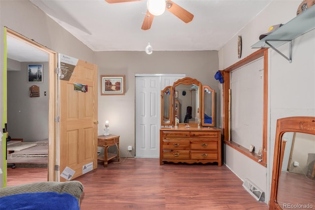 bedroom with ceiling fan and dark hardwood / wood-style flooring