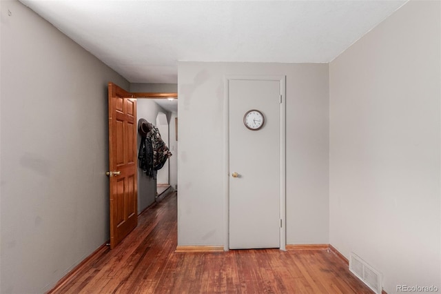 hallway featuring hardwood / wood-style floors