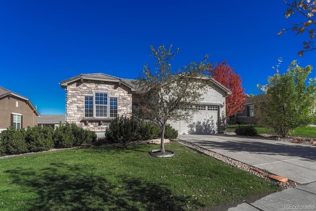 view of front of home with a garage and a front lawn