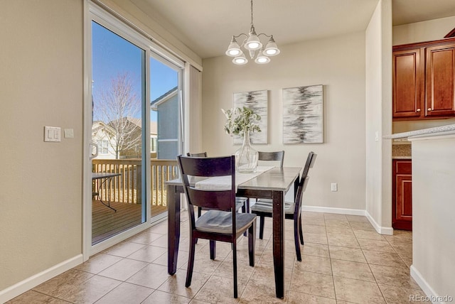 tiled dining space featuring a notable chandelier