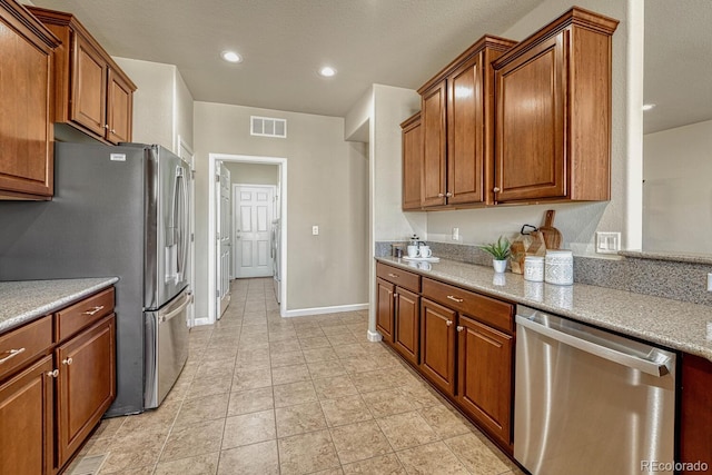 kitchen featuring appliances with stainless steel finishes and washer / dryer