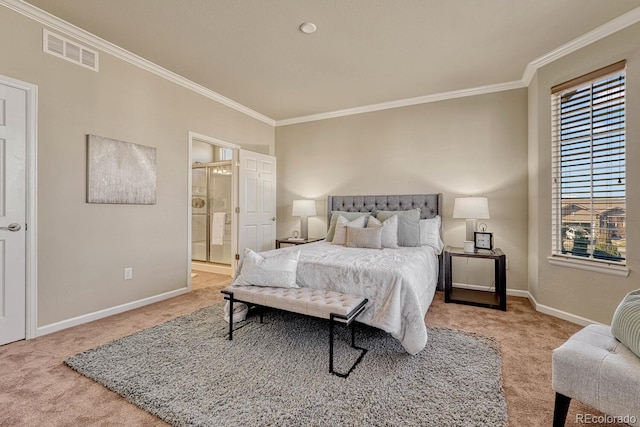 bedroom featuring crown molding, light colored carpet, and ensuite bath