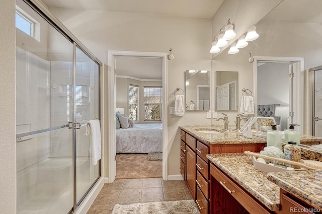 bathroom with walk in shower, tile patterned floors, and vanity