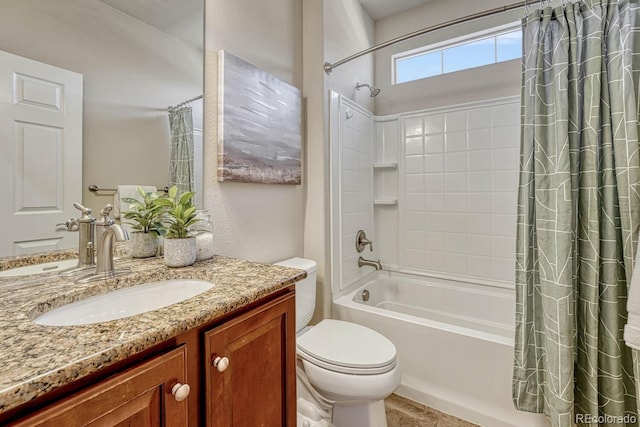 full bathroom with toilet, vanity, and shower / bath combo