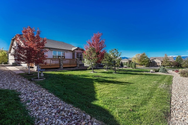 view of yard featuring a wooden deck