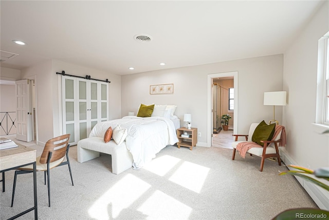 bedroom featuring light colored carpet