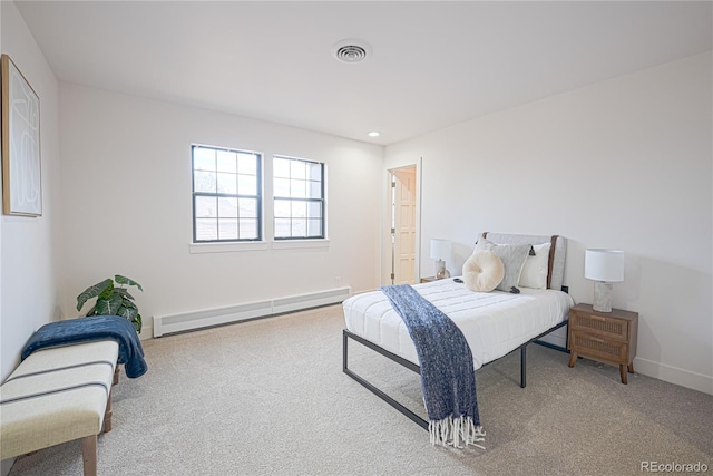 bedroom featuring carpet floors and a baseboard radiator