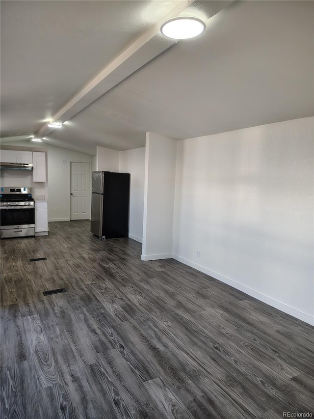 unfurnished living room with vaulted ceiling with beams, baseboards, and dark wood finished floors