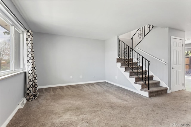 6711 S Race St, Centennial, CO 80122 - unfurnished living room with carpet flooring, stairs, and baseboards