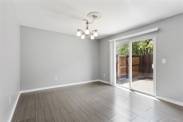 6711 S Race St, Centennial, CO 80122 - unfurnished room with a chandelier and baseboards