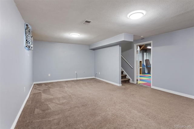 6711 S Race St, Centennial, CO 80122 - finished below grade area featuring carpet flooring, stairway, baseboards, and a textured ceiling
