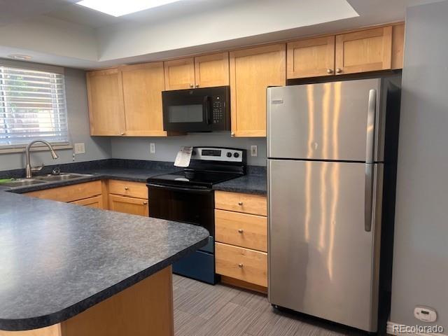 6711 S Race St, Centennial, CO 80122 - kitchen featuring black microwave, freestanding refrigerator, electric stove, a sink, and dark countertops