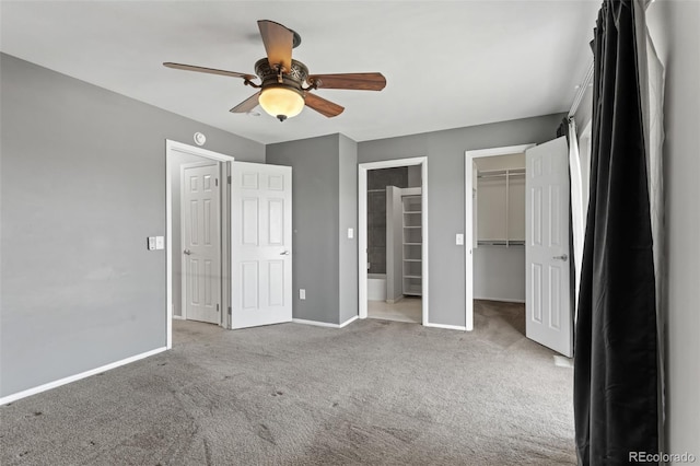 6711 S Race St, Centennial, CO 80122 - unfurnished bedroom featuring carpet floors, baseboards, a spacious closet, a ceiling fan, and a closet