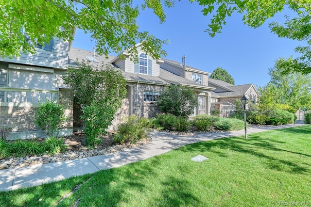 view of front of home with a front lawn