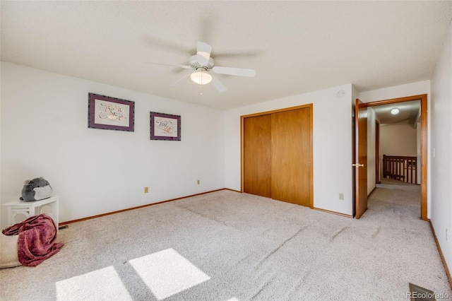 10436 W 84th Pl, Arvada, CO 80005 - unfurnished bedroom with carpet, a closet, a ceiling fan, and baseboards