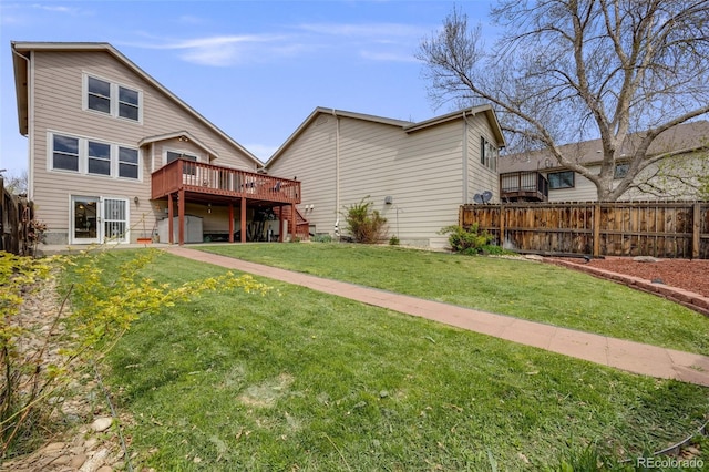 10436 W 84th Pl, Arvada, CO 80005 - rear view of property featuring fence, a yard, stairway, and a deck