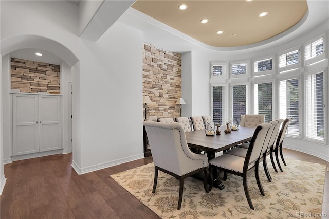 917 Dakota Dr, Castle Rock, CO 80108 - dining area with recessed lighting, arched walkways, and wood finished floors