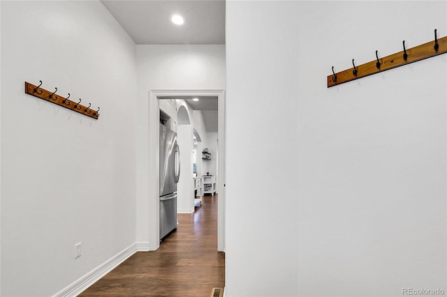 917 Dakota Dr, Castle Rock, CO 80108 - hallway with arched walkways, dark wood finished floors, and recessed lighting