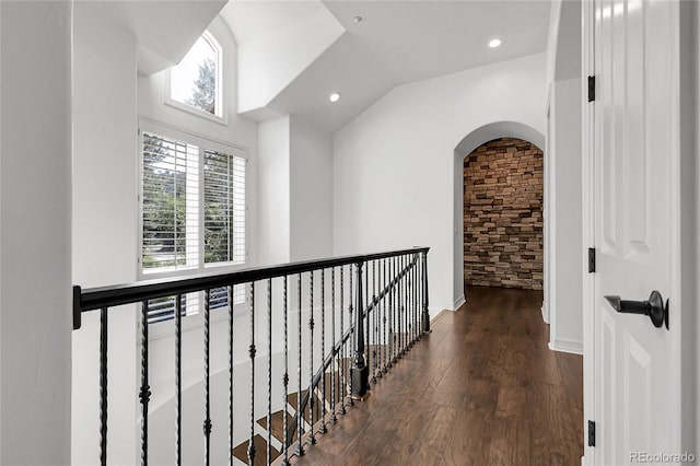 917 Dakota Dr, Castle Rock, CO 80108 - hallway with wood finished floors, lofted ceiling, arched walkways, and recessed lighting