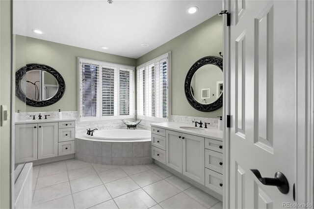 917 Dakota Dr, Castle Rock, CO 80108 - full bathroom featuring a bath, two vanities, tile patterned flooring, and recessed lighting