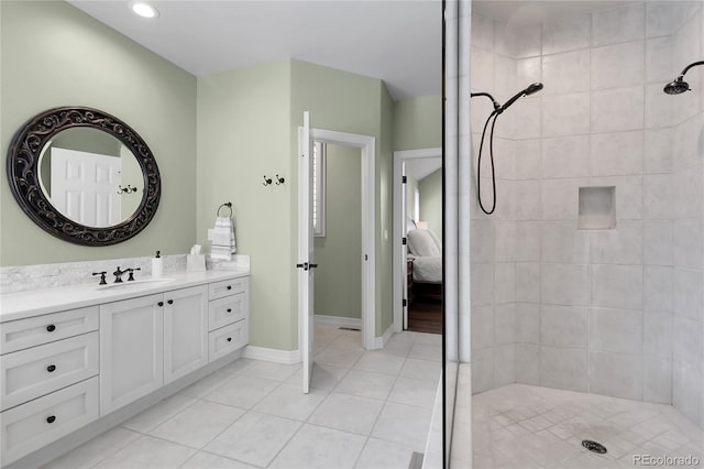 917 Dakota Dr, Castle Rock, CO 80108 - bathroom with vanity, a tile shower, tile patterned floors, ensuite bathroom, and recessed lighting