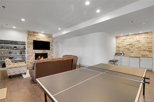 917 Dakota Dr, Castle Rock, CO 80108 - game room with dark wood-type flooring, recessed lighting, and a fireplace