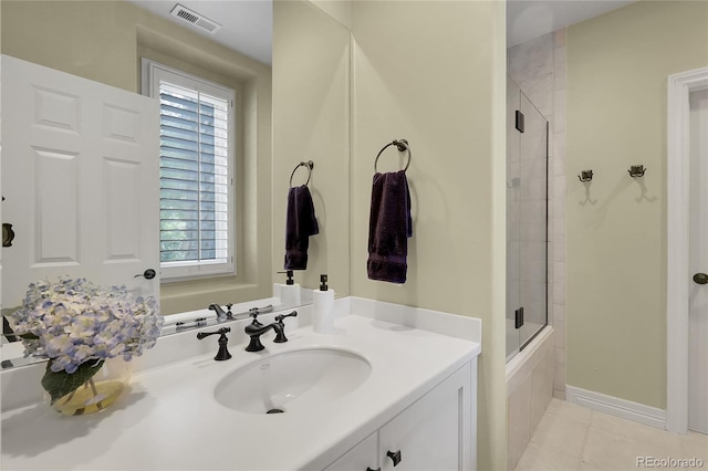 917 Dakota Dr, Castle Rock, CO 80108 - bathroom with a tile shower, vanity, and tile patterned floors