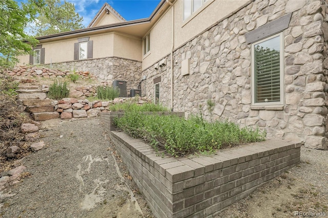 917 Dakota Dr, Castle Rock, CO 80108 - view of side of property featuring stone siding and stucco siding
