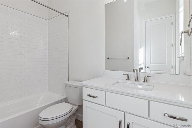 full bathroom with vanity, toilet, and tiled shower / bath combo