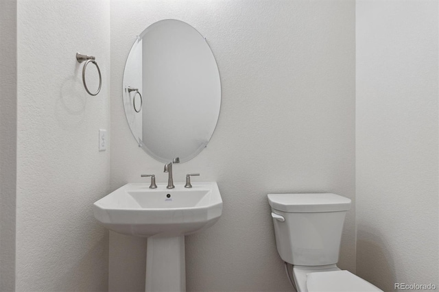 bathroom with sink and toilet