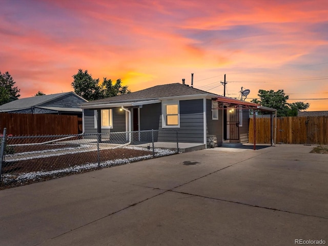 3971 W Kentucky Ave, Denver, CO 80219 - view of front of home featuring concrete driveway and a porch