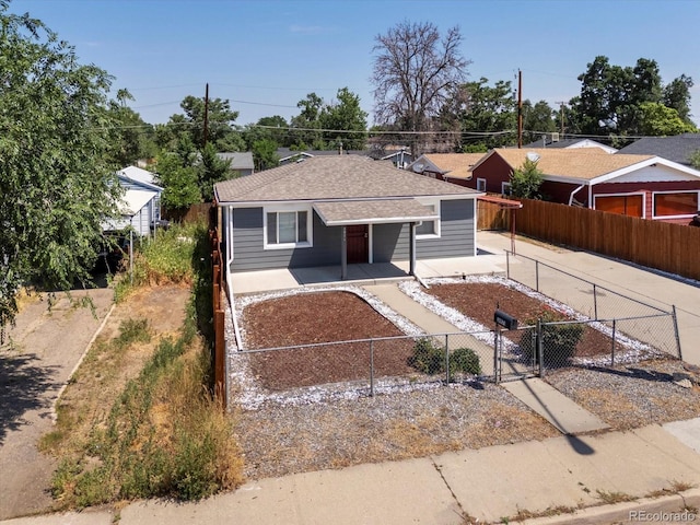 3971 W Kentucky Ave, Denver, CO 80219 - ranch-style home with covered porch, a shingled roof, a fenced front yard, and a gate