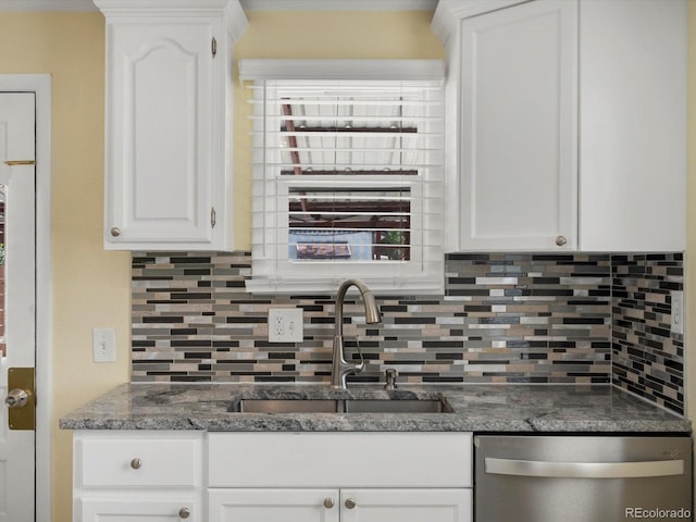 3971 W Kentucky Ave, Denver, CO 80219 - kitchen featuring dishwasher, tasteful backsplash, white cabinets, and dark stone counters