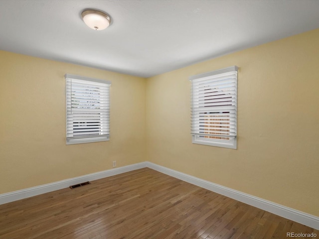 3971 W Kentucky Ave, Denver, CO 80219 - spare room with wood finished floors and baseboards
