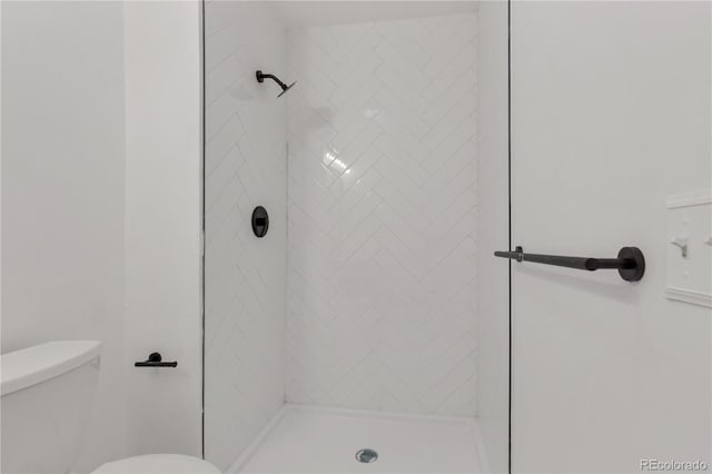 full bath with a shower stall and toilet