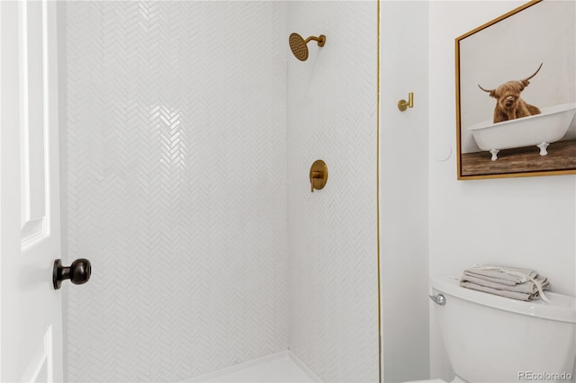 bathroom with toilet and a shower