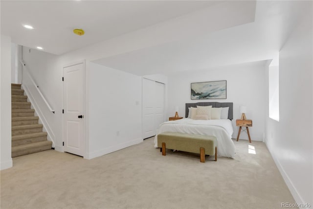 bedroom featuring light carpet, baseboards, and recessed lighting