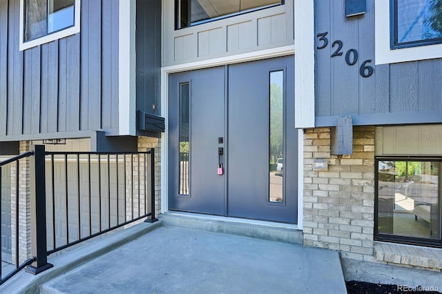 3206 S Pontiac St, Denver, CO 80224 - entrance to property with board and batten siding