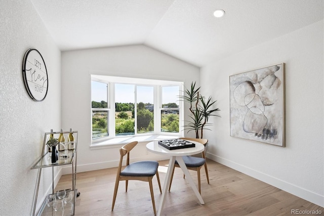 3206 S Pontiac St, Denver, CO 80224 - dining space featuring lofted ceiling and light wood-style flooring