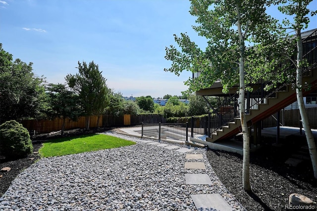3206 S Pontiac St, Denver, CO 80224 - fenced backyard with a patio and stairs