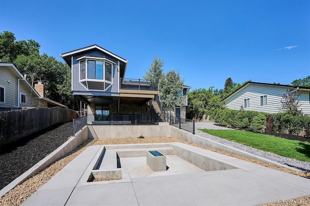 3206 S Pontiac St, Denver, CO 80224 - rear view of house with stairs and a patio