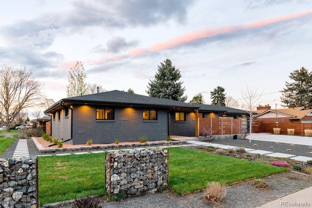 view of front of property with a yard