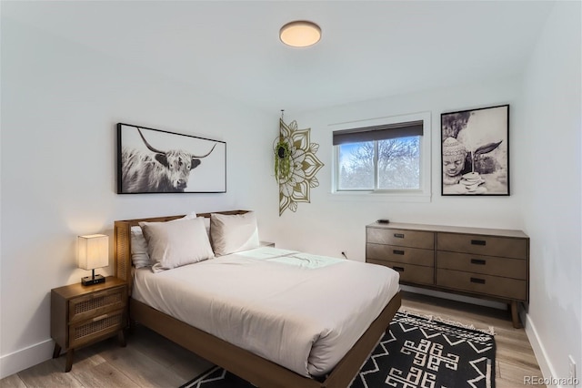 bedroom featuring light wood-type flooring