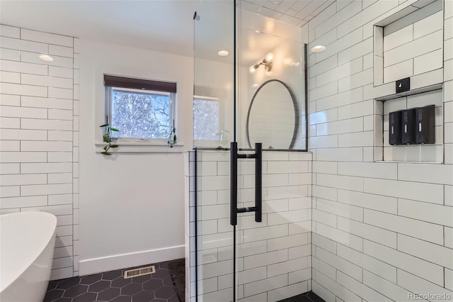 bathroom with plus walk in shower and tile patterned floors