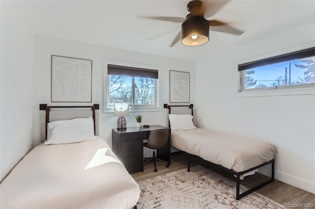 bedroom with light wood-type flooring and ceiling fan